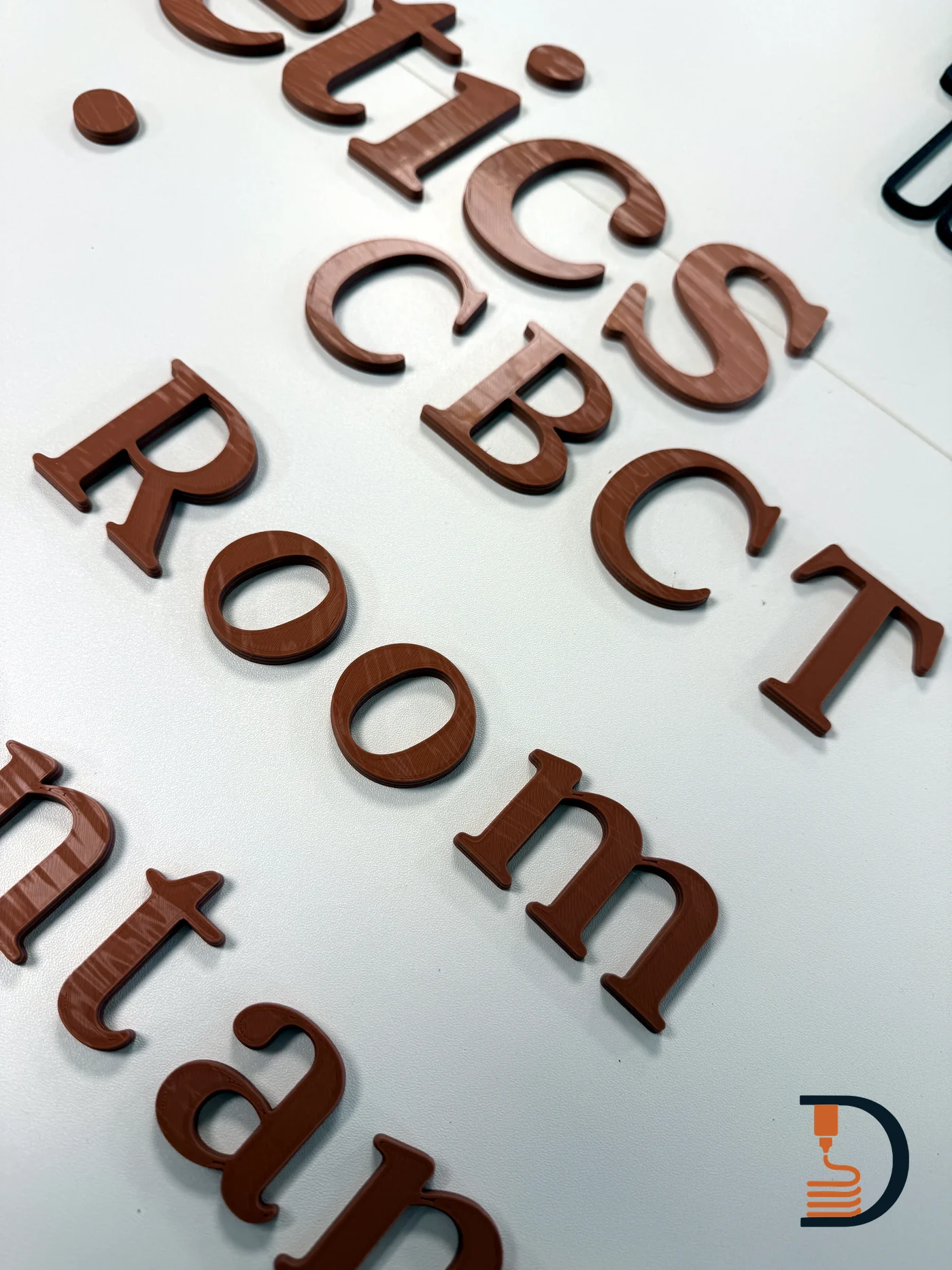 Close view of printed lettering showing the layer texture